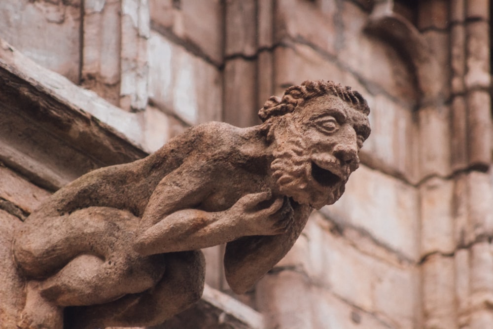 man-themed figure on side of building