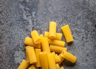 yellow pasta on gray surface