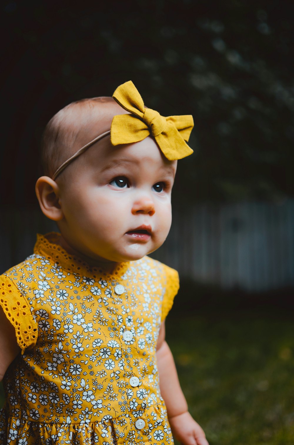 baby in yellow dress