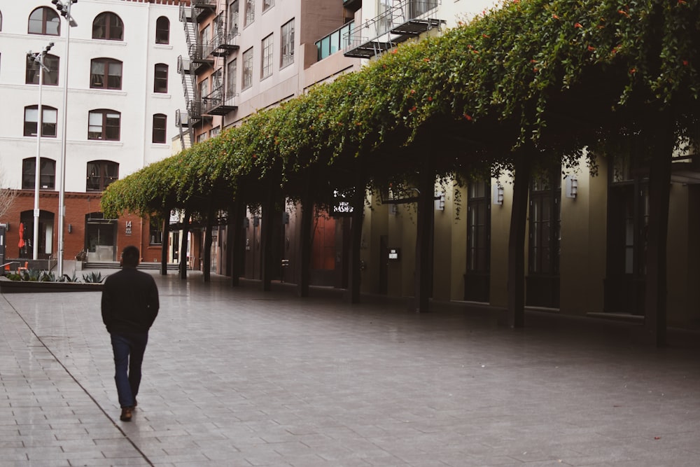 man standing near trees