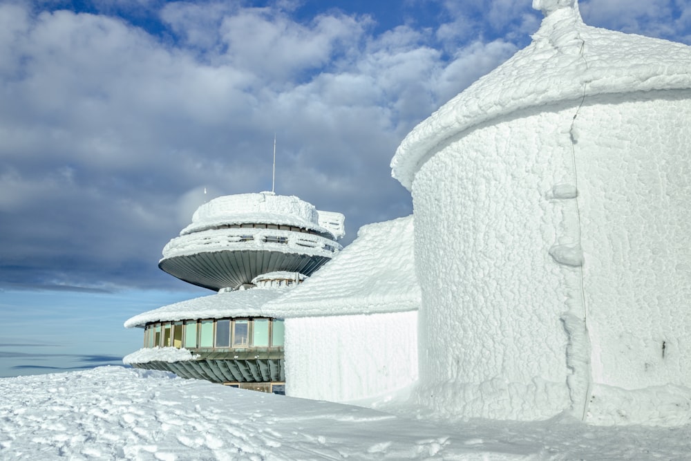 white house coated with snow under white sky