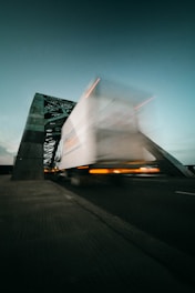 time lapse photography of truck going on bridge