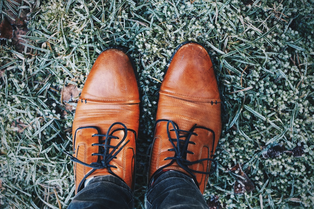 pair of brown leather dress shoes