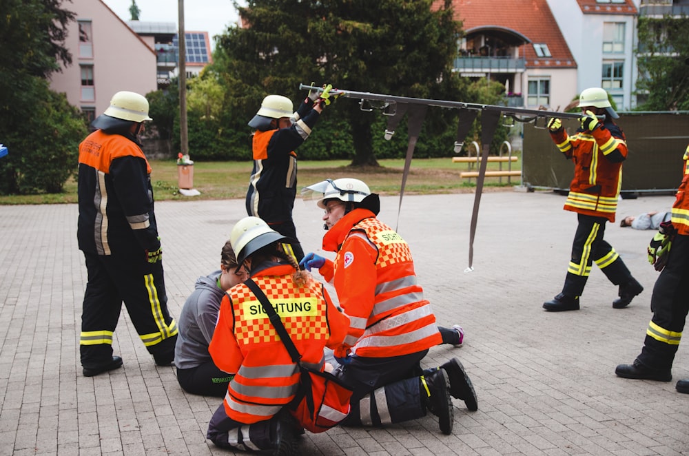 firemen performing drill outdoors