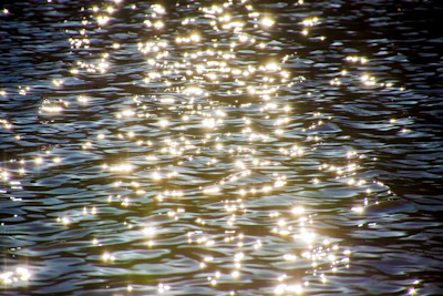 Sunlight reflecting off ocean waves creating sparkling, dynamic textures.