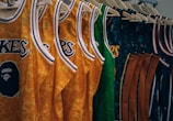 assorted NBA jerseys hanged on clothes hangers