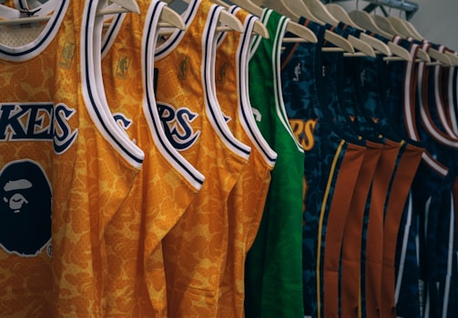 assorted NBA jerseys hanged on clothes hangers