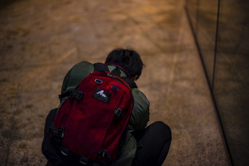 man wearing black backpack