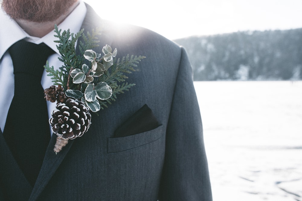 man in gray blazer with corsage