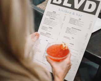 person holding BLVD poster