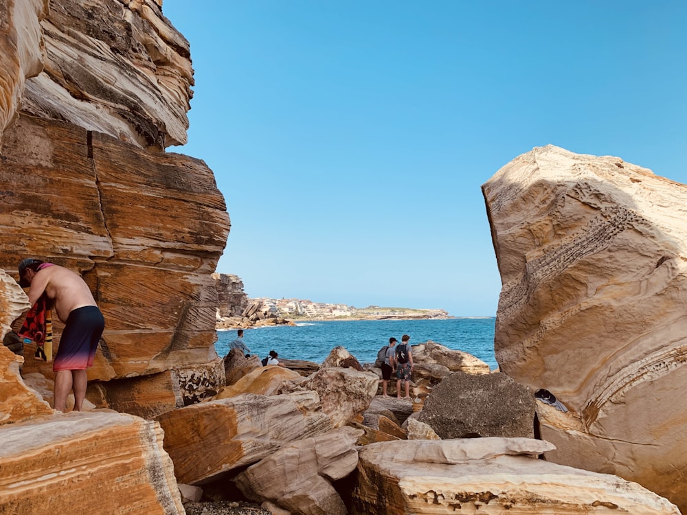 person standing on stones during daytime