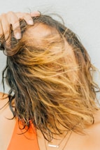 woman in orange tank top