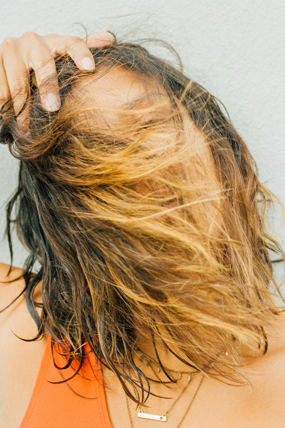 woman in orange tank top