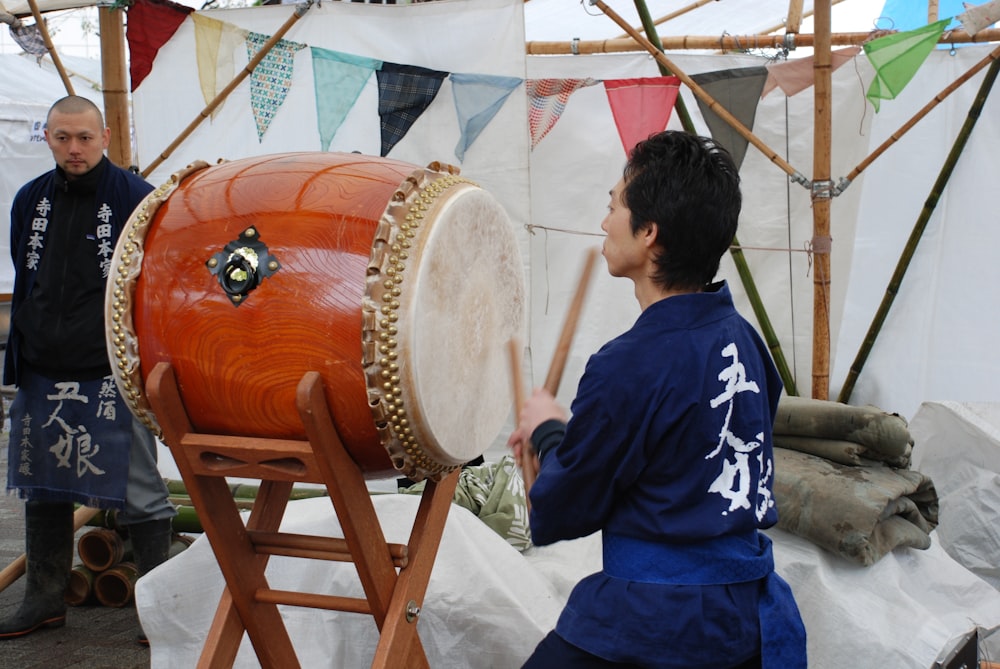 man playing taiko drum