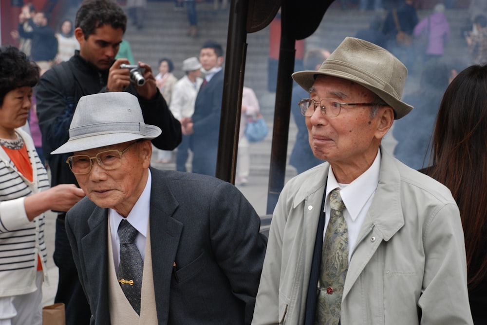 two man wearing suit