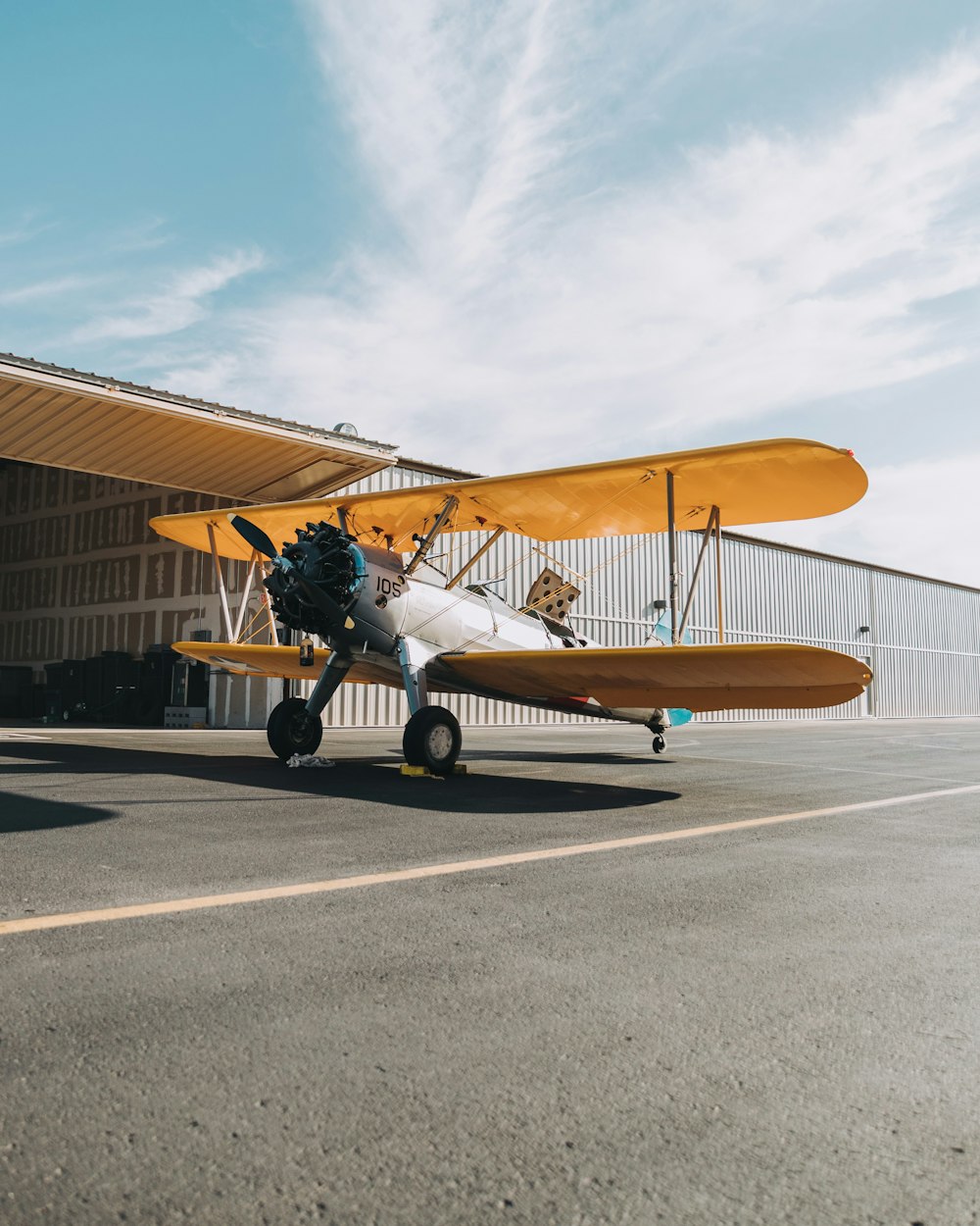 yellow and gray biplane