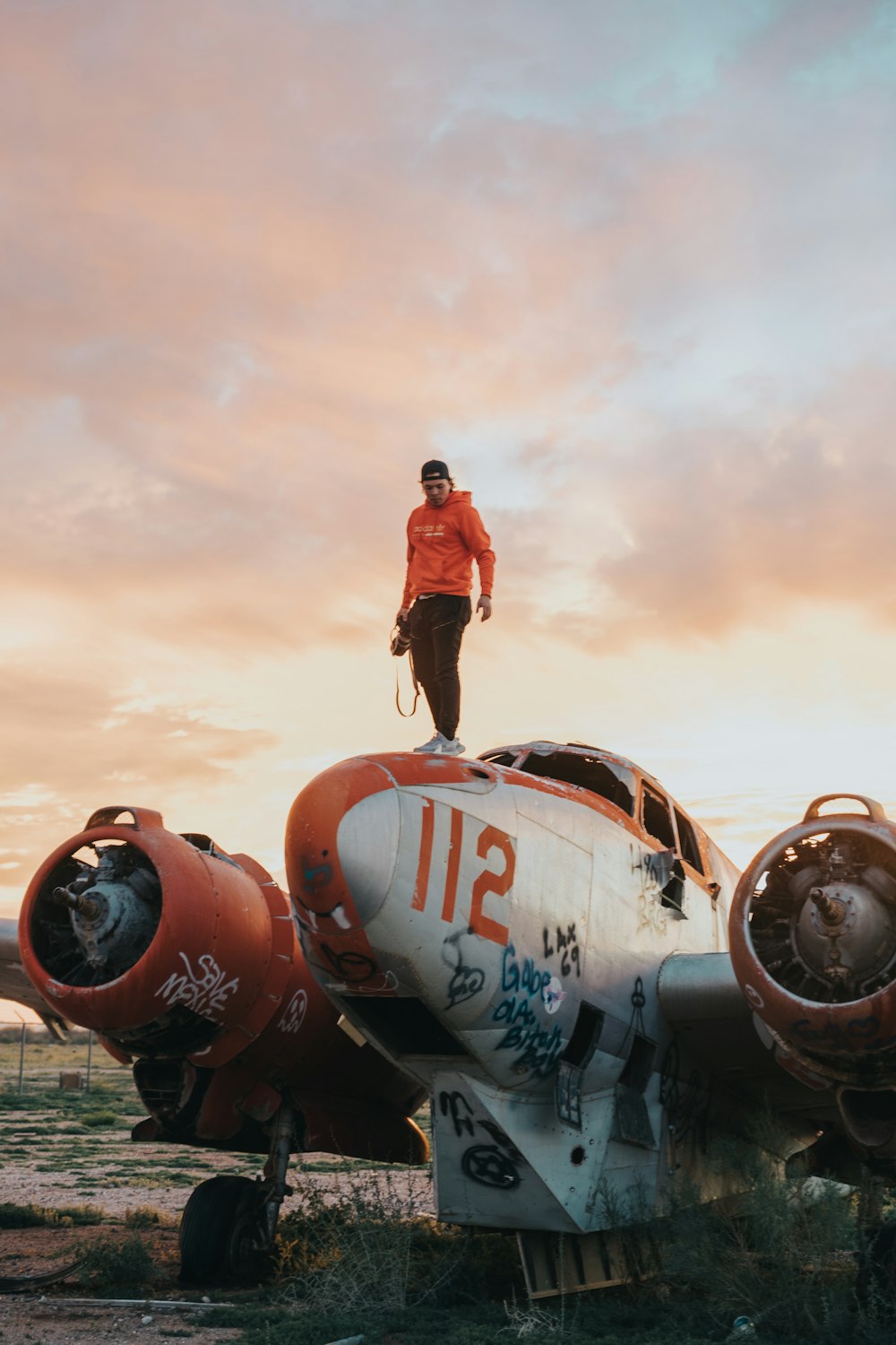 man stand on wrecked plane