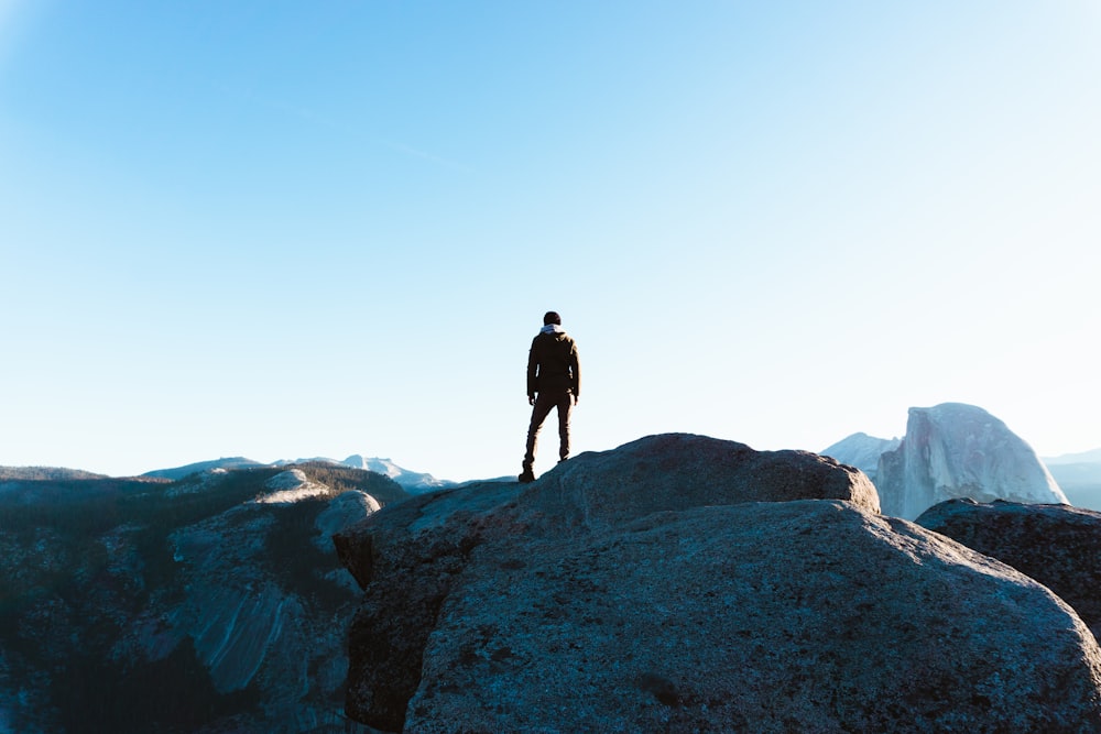 man standing on cliff