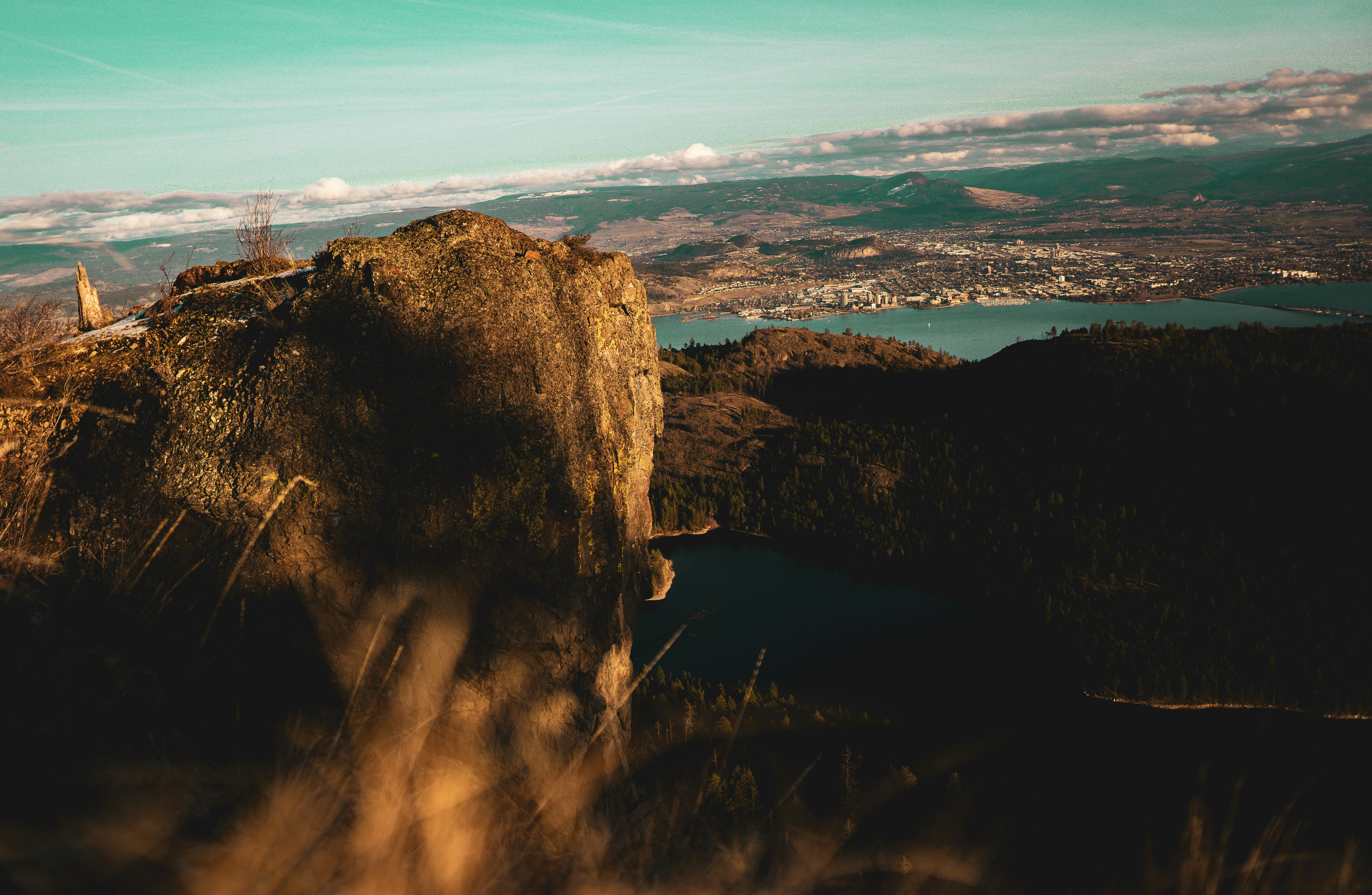 rock formation near body of water during daytime