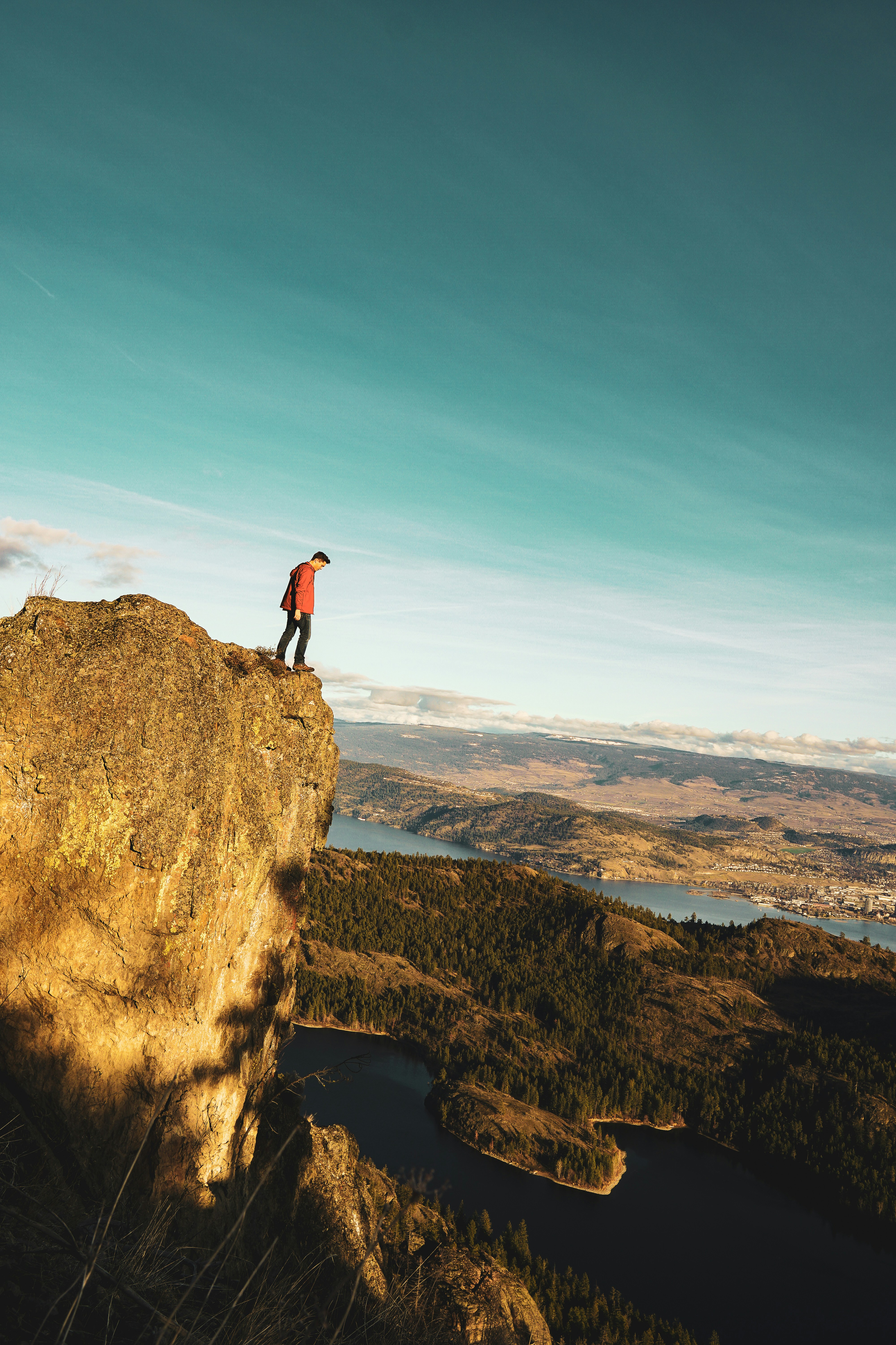 man standing on moutnain edge