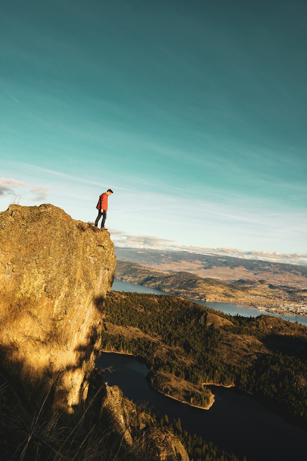 man standing on moutnain edge