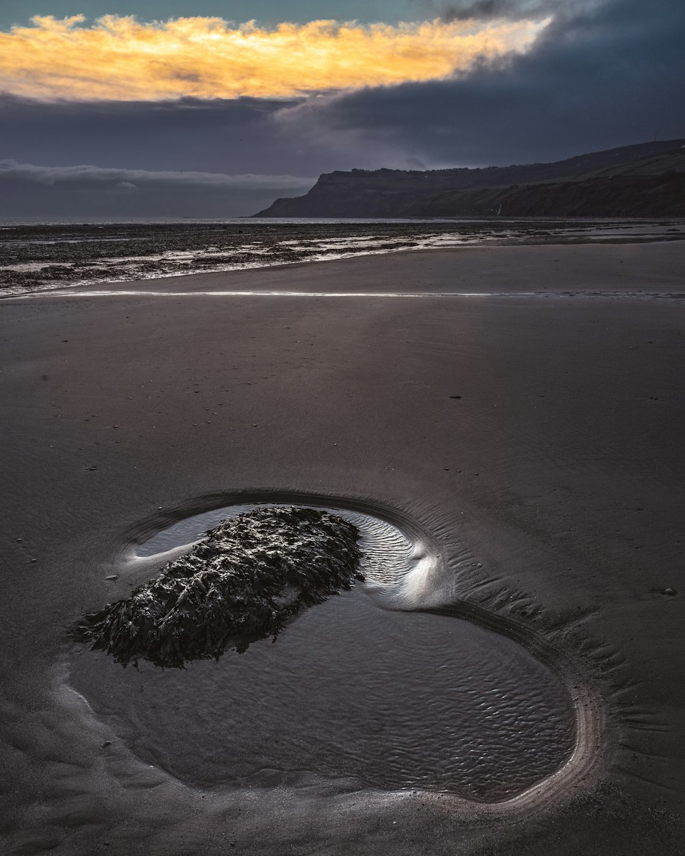 gray sand on seashore