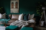 brown leather padded sofa with throw pillows inside house