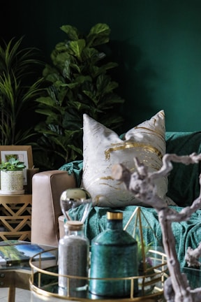 A serene living room bathed in natural light with feng shui elements and golden accents.