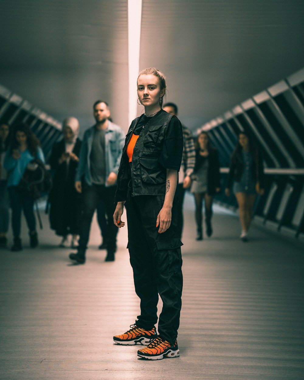 woman standing in the middle of the tunner