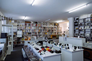 assorted-product displays on white shelf