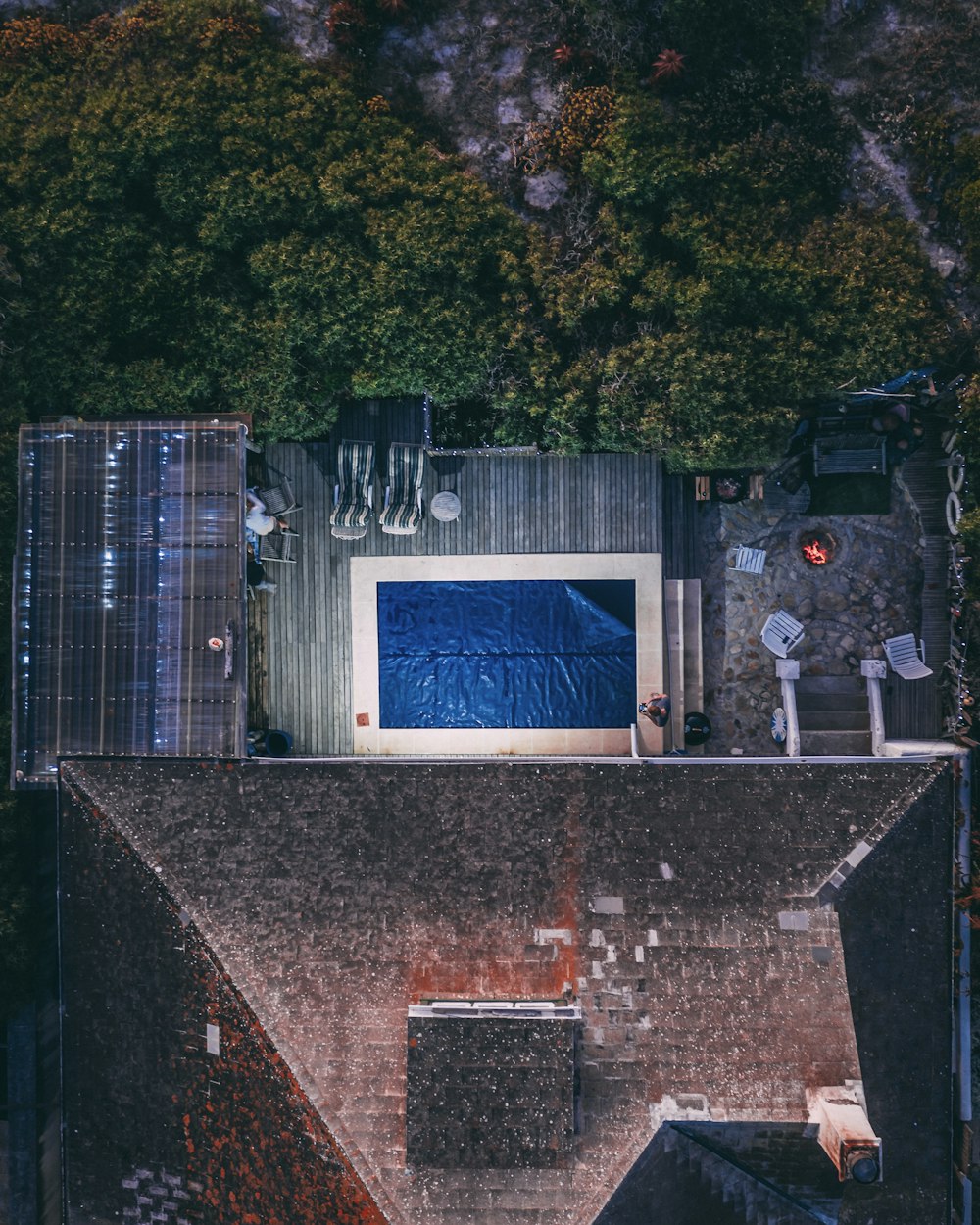 aerial view of house with outdoor pool and garden