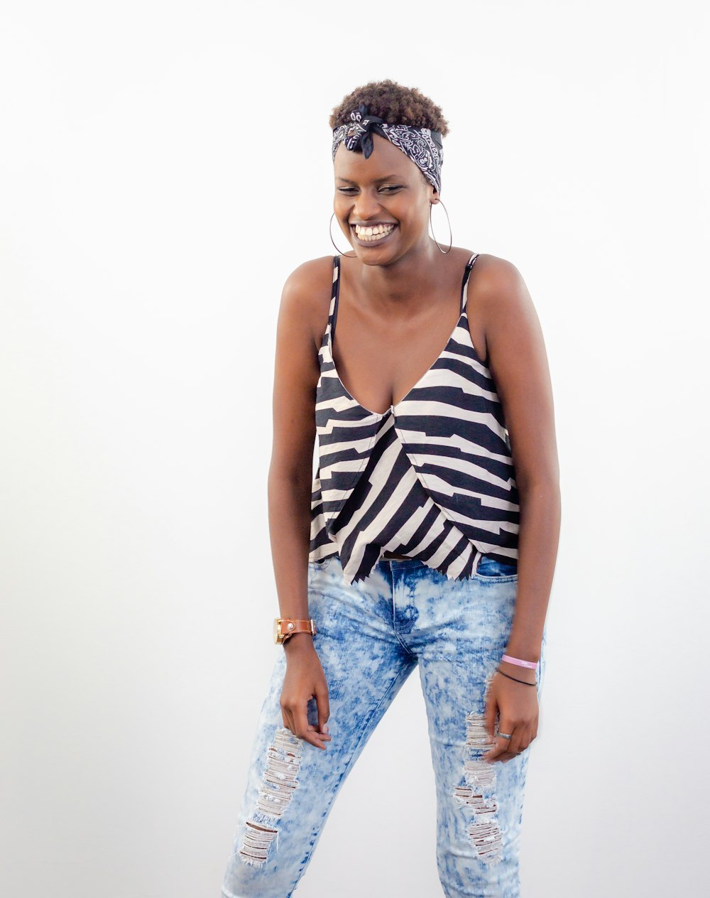 woman wearing white and black spaghetti-strap top