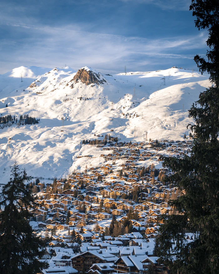 Ski chalets and snow-covered peaks above Verbier, Switzerland