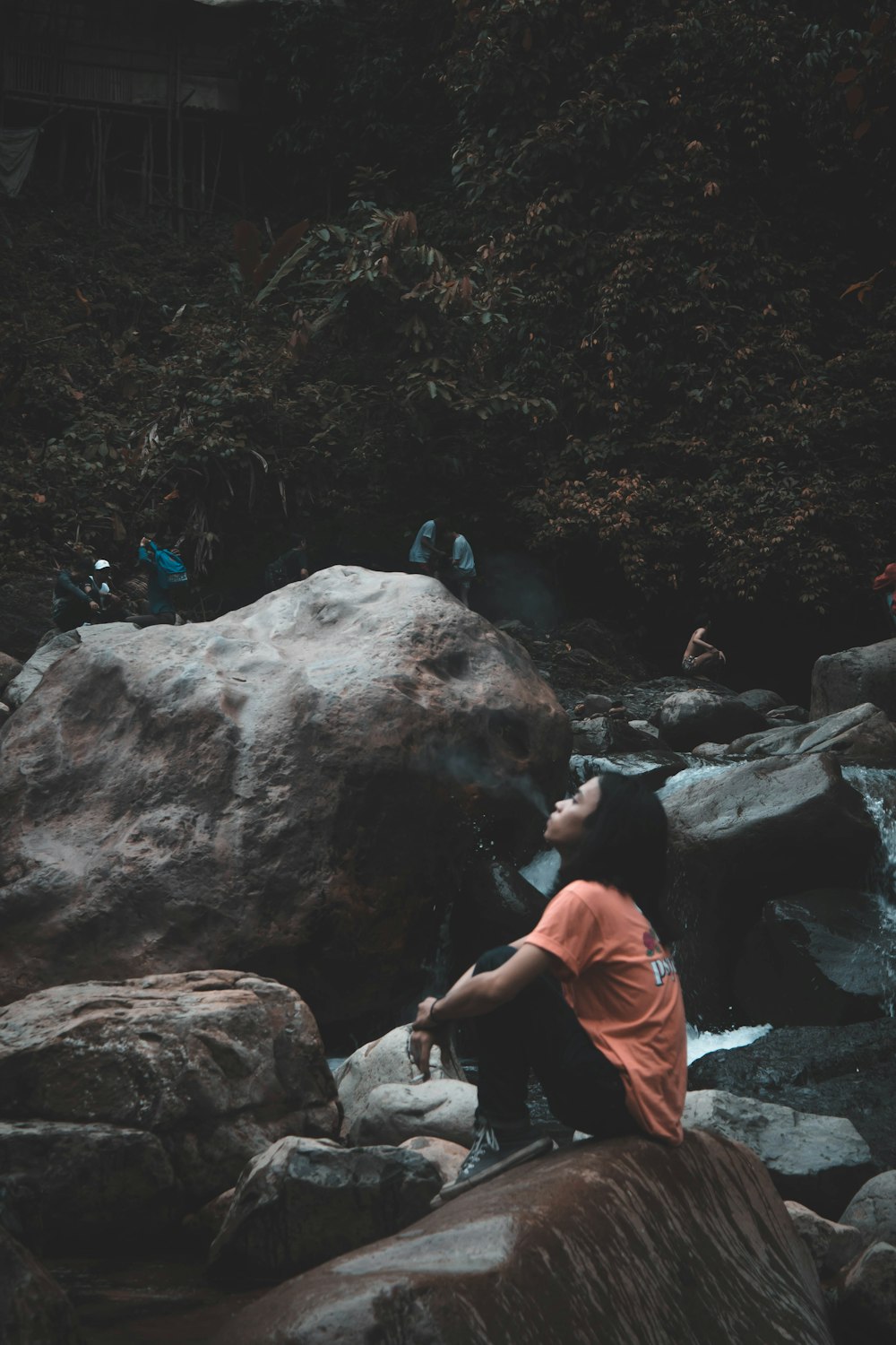 woman sitting on stone