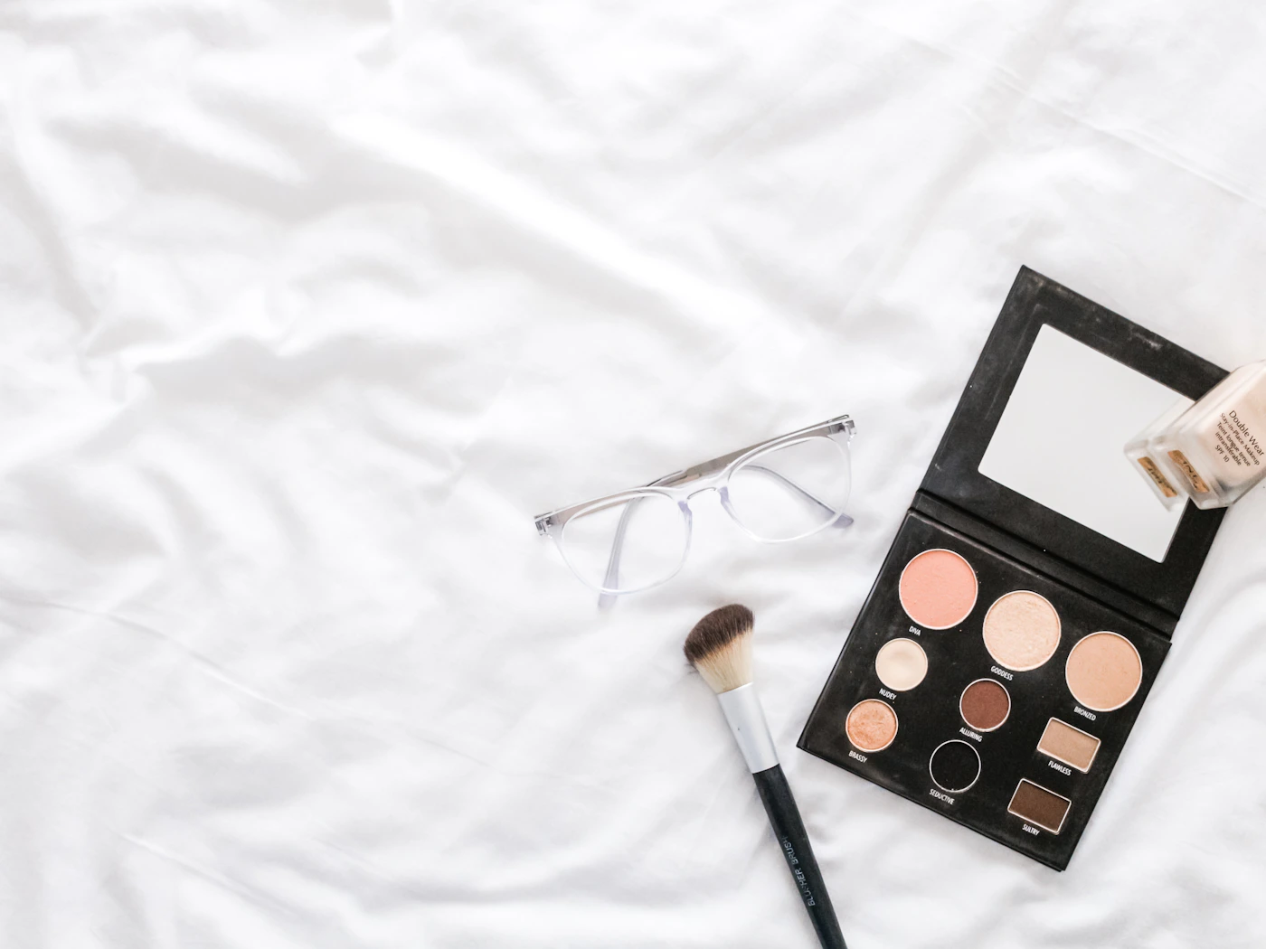 Beauty brush and makeup palette prepared for application
