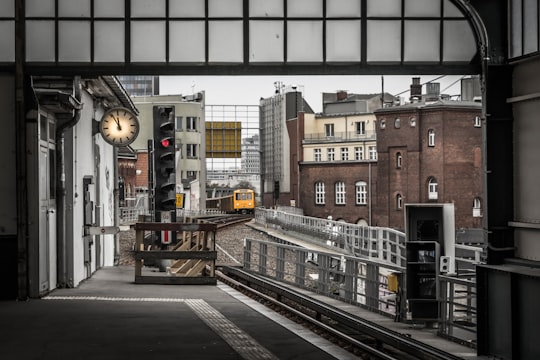 yellow train on railroad during daytime in U Gleisdreieck (Berlin) Germany