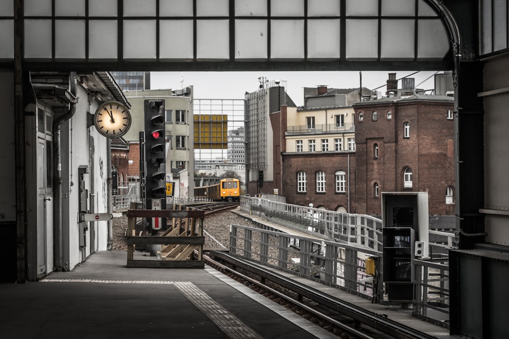 yellow train on railroad during daytime