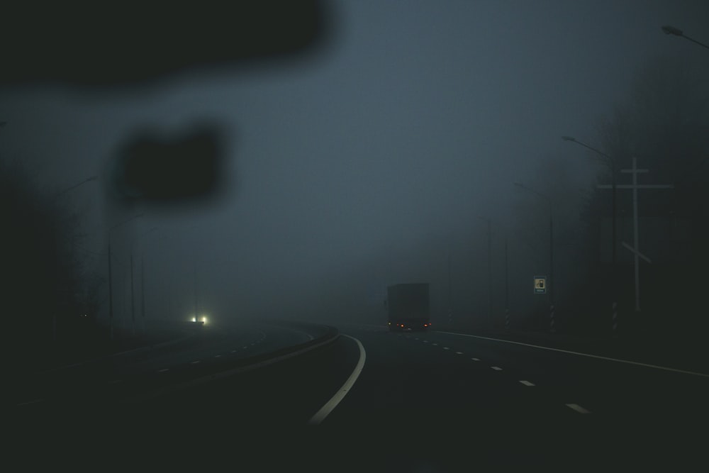 box truck on roadway at nighttime