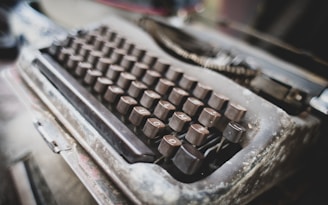 An old typewriter with worn keys, symbolizing stories from the past.