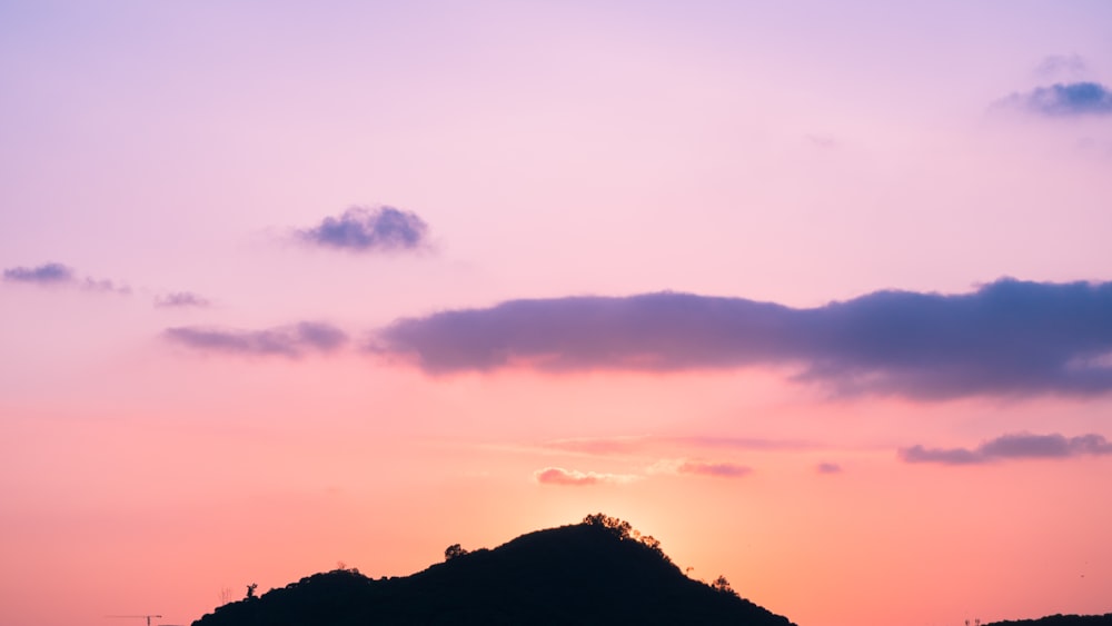 silhouette of mountain at golden hour