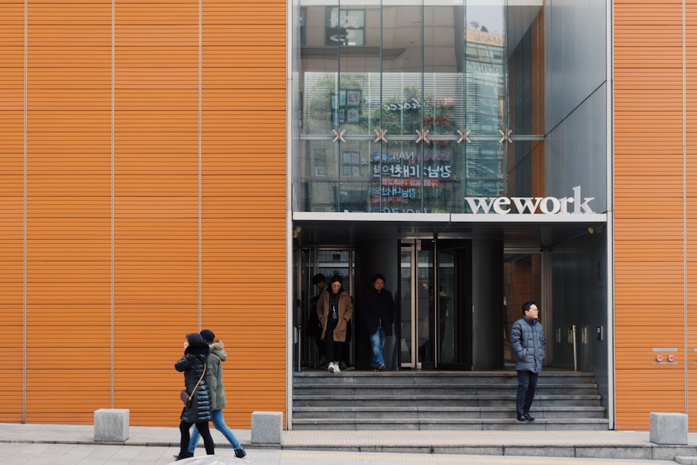 two person walking near Wework building