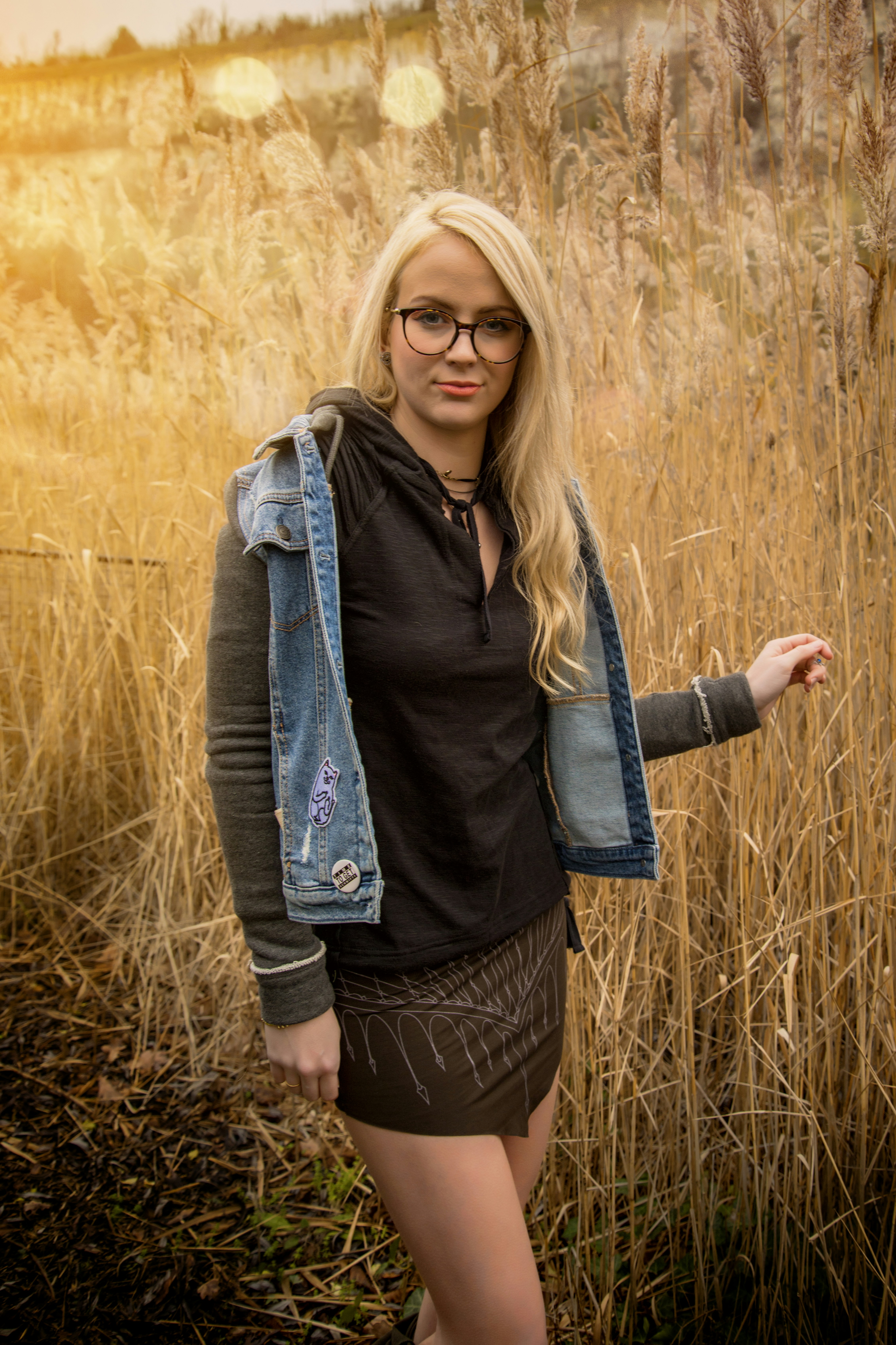 woman standing in brown field
