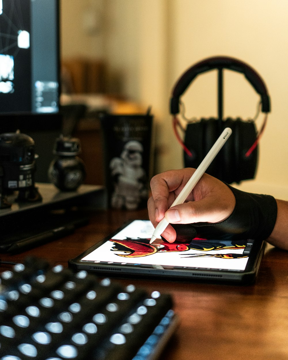 close-up photography of person drawing on tablet computer