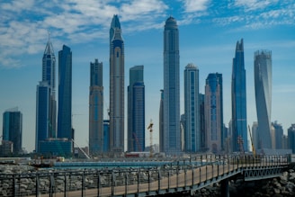 blue concrete city buildings under white and blue cloudy sky