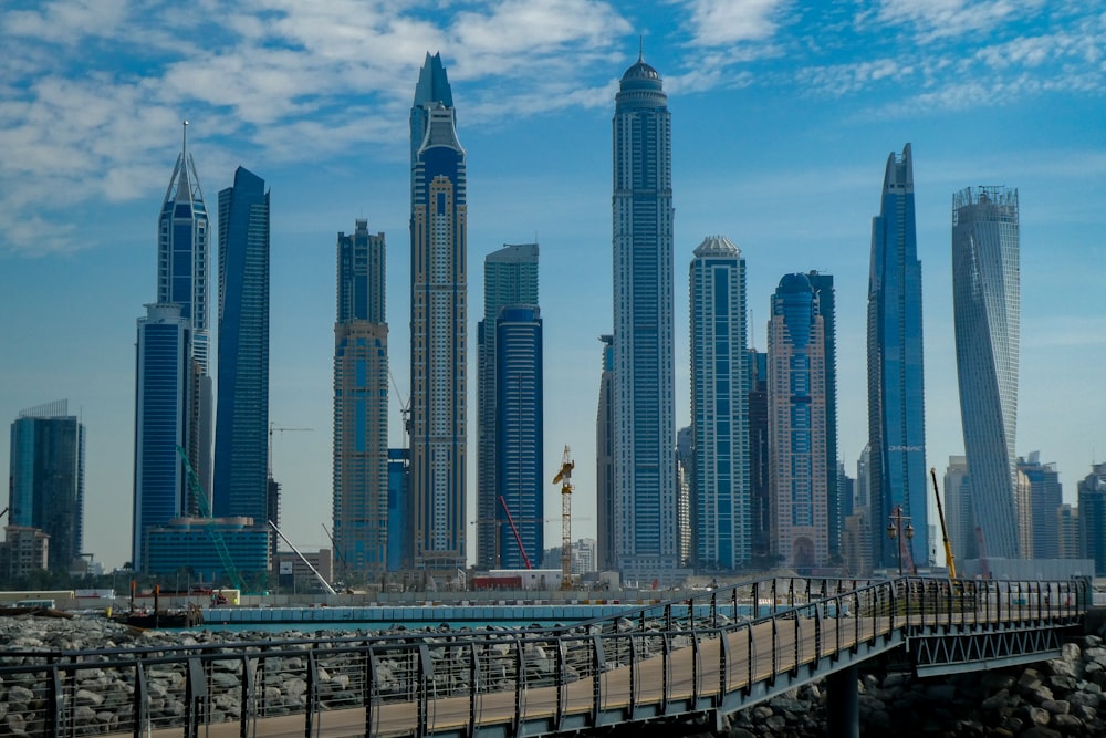 blue concrete city buildings under white and blue cloudy sky