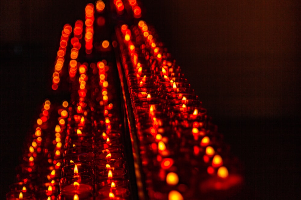 a close up of a row of lit candles