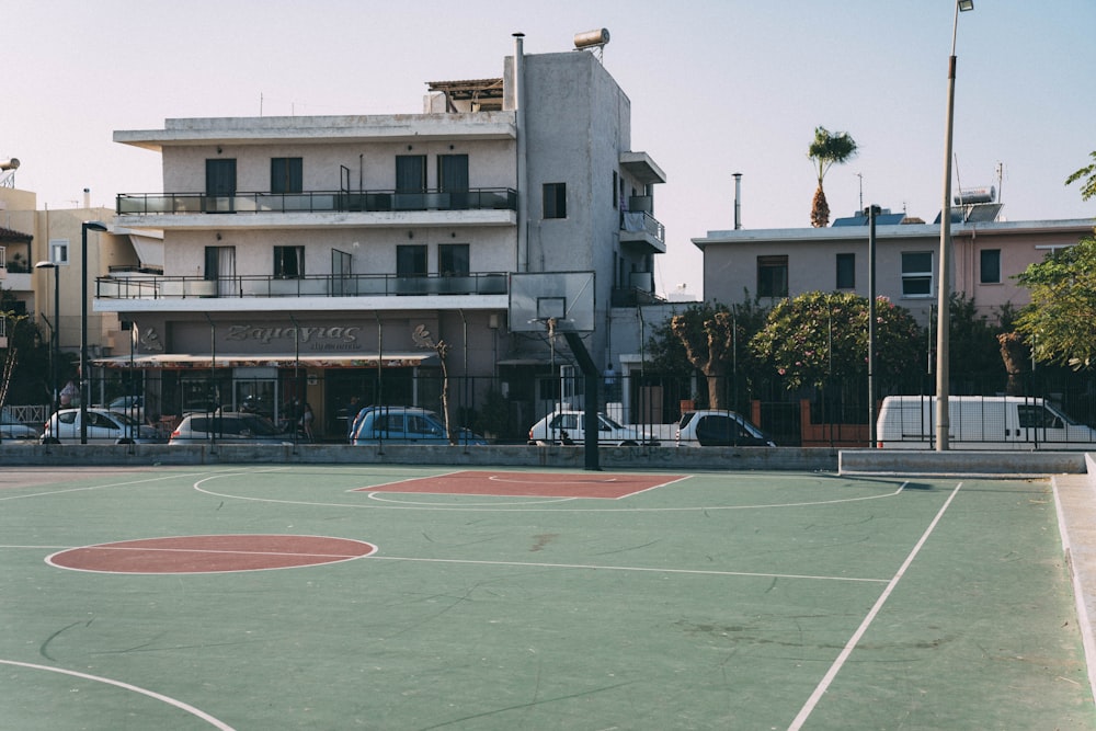 basketball court near building during daytime