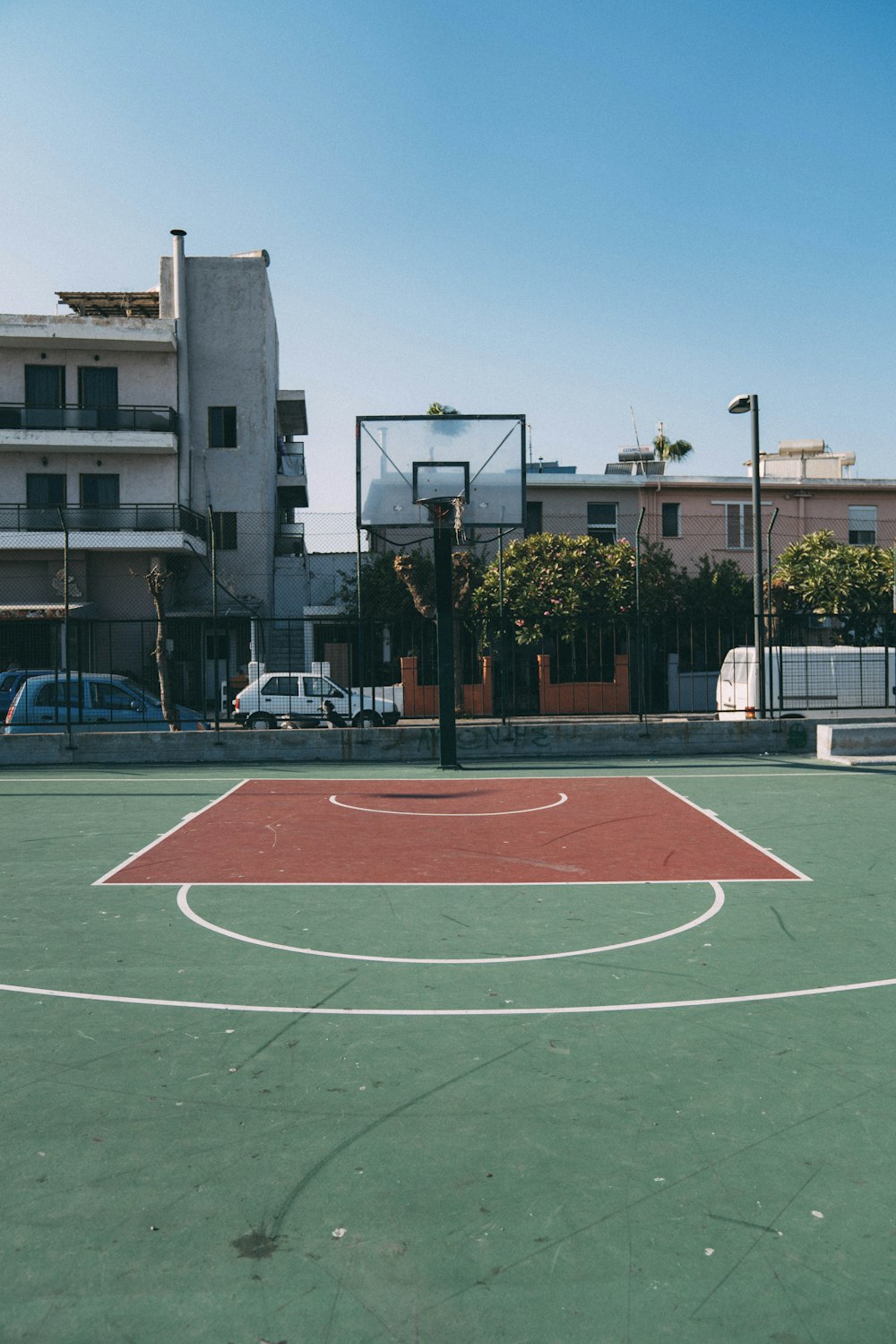 empty outdoor basketball court during daytime