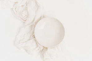 A clean white background showcasing a premium kraft paper bowl with subtle shadowing.