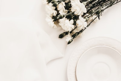 round white ceramic plate on white surface elegant zoom background